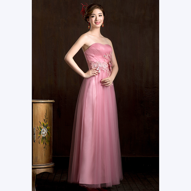 kudapy ชุดราตรียาวสีชมพู หวานเกาะอก ผ้าตาข่ายทั้งชุด อกจับจีบ แต่งดอกคาดเอว & พร้อมเม็ดคริสตัลหรู