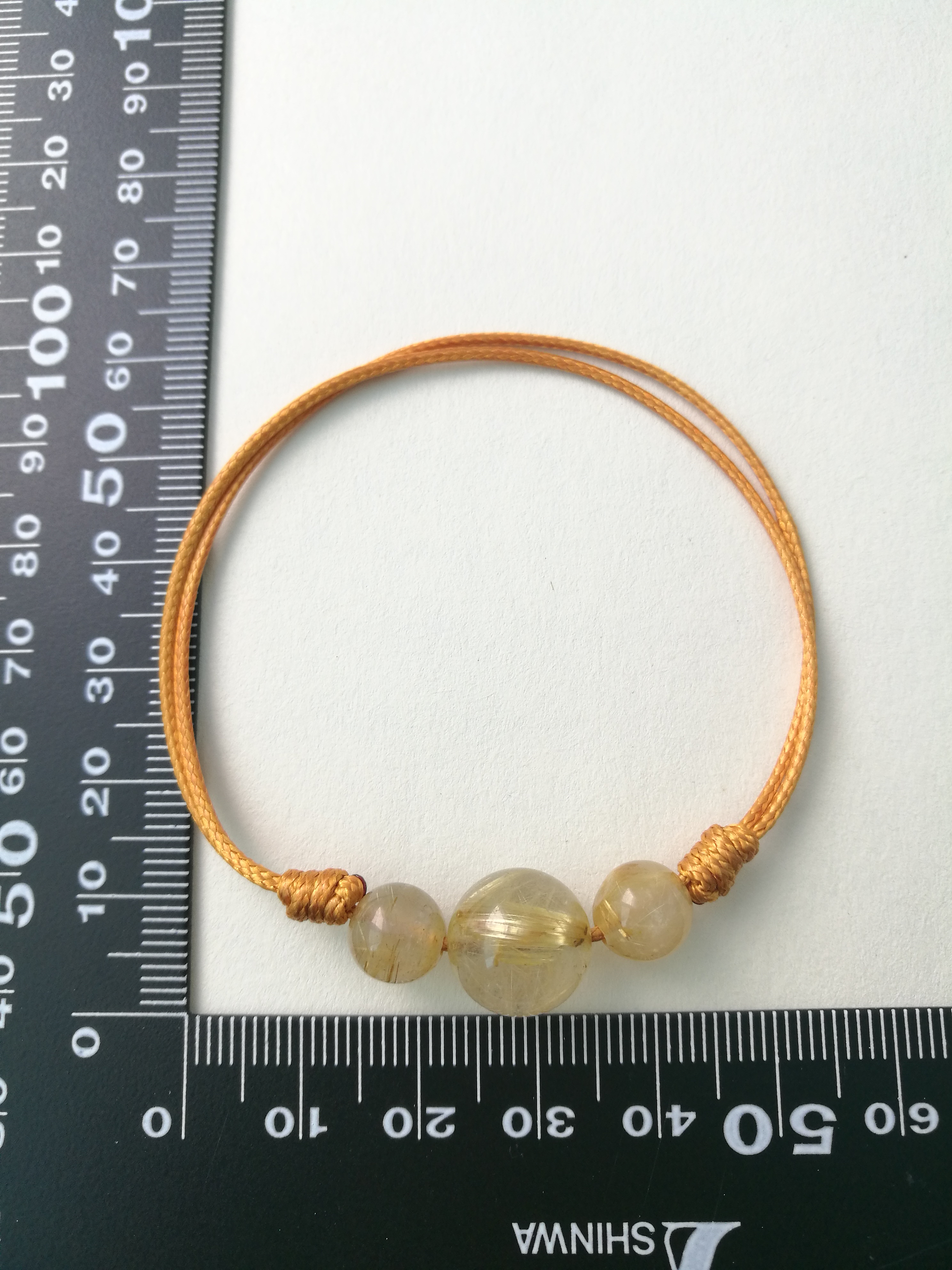 สร้อยข้อมือหินไหมทอง