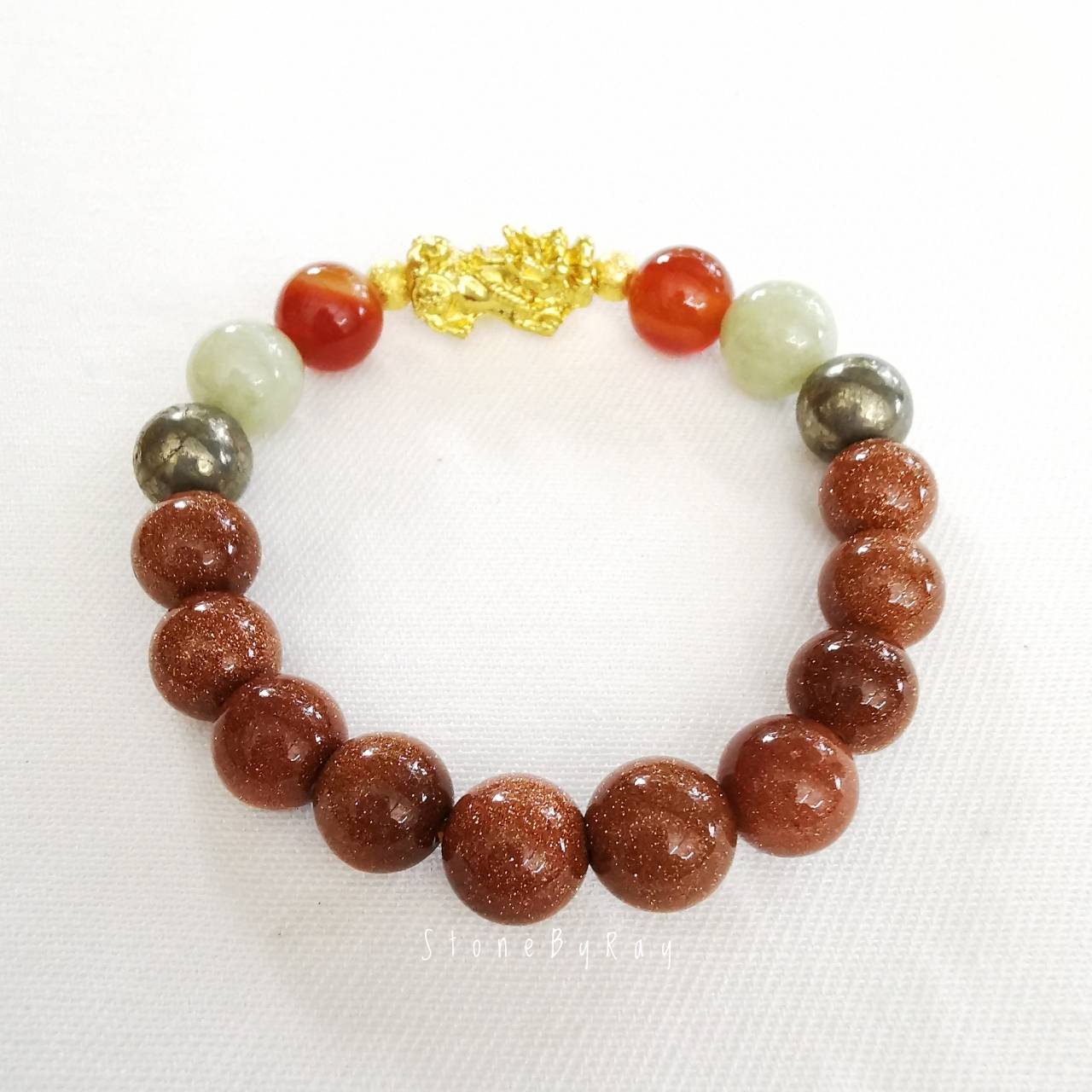สร้อยข้อมือหินคาเนเลี่ยน,หินทรายทอง,หยก,ไพไรต์ร้อยกับปี่เซี่ยะสีทอง