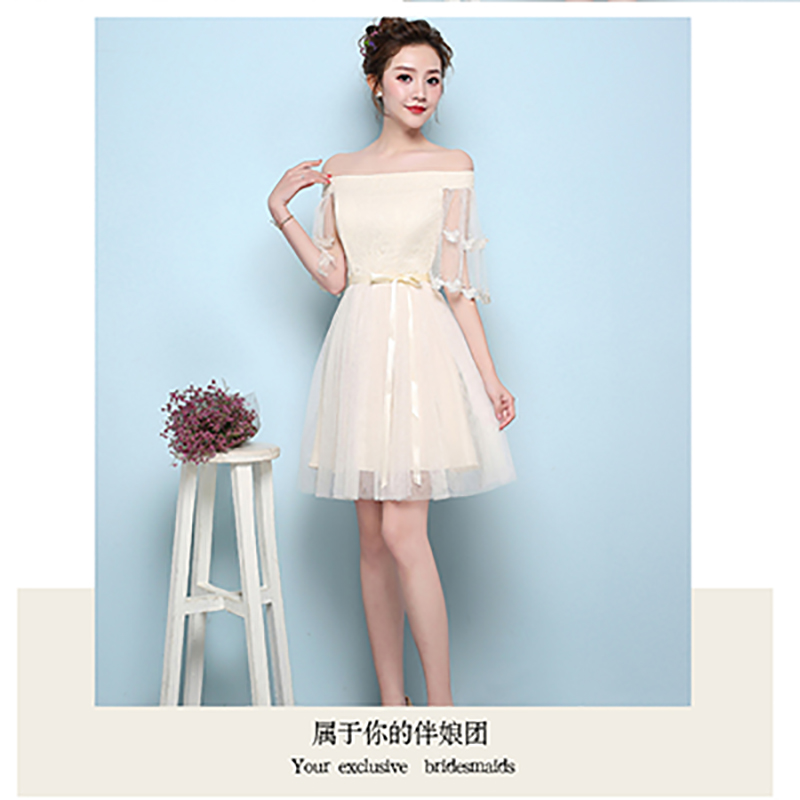 kudapy เดรสสั้นสีครีม ราตรีออกงาน เปิดไหล่แต่งลายผีเสื้อ ตัวเดรสลายดอกไม้ ช่วงเอวคาดผ้าริ้บบิ้นผูก ซิบด้านข้างลำตัว สม๊อกหลัง