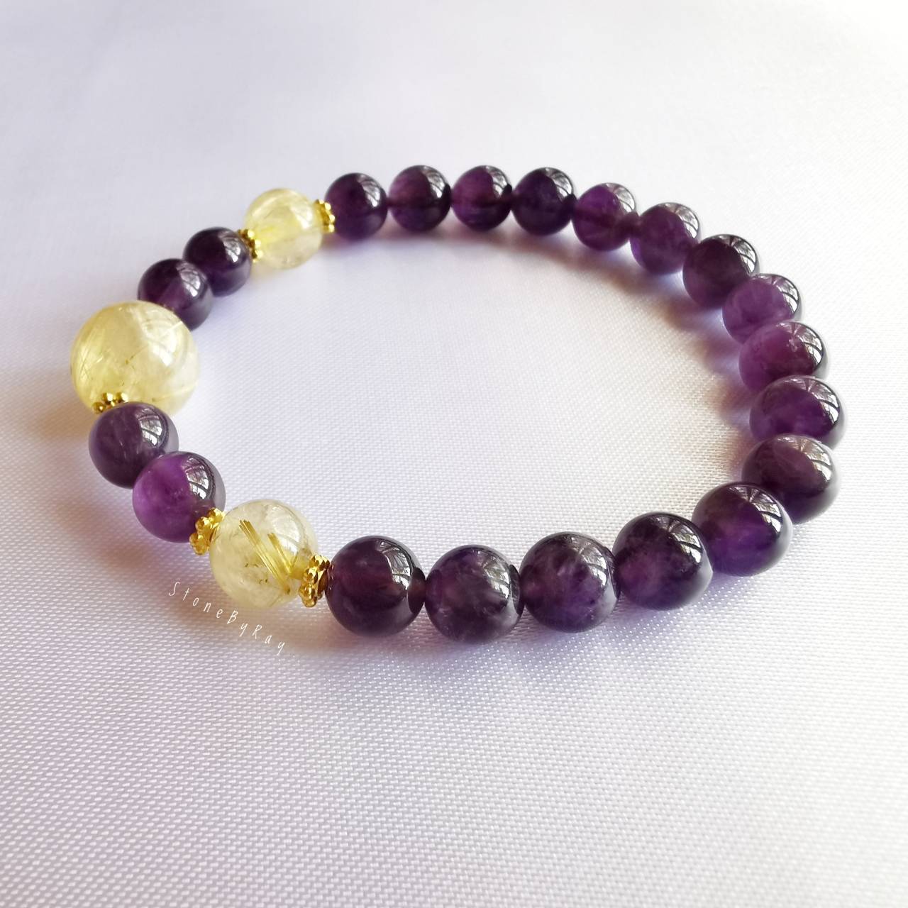 สร้อยข้อมือหินอเมทิสต์ร้อยกับหินไหมทอง Amethyst+Rutilated Quartz