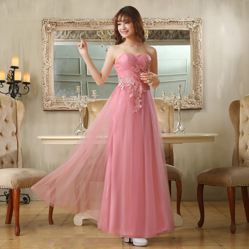 kudapy ชุดราตรียาวสีชมพู หวานเกาะอก ผ้าตาข่ายทั้งชุด อกจับจีบ แต่งดอกคาดเอว & พร้อมเม็ดคริสตัลหรู