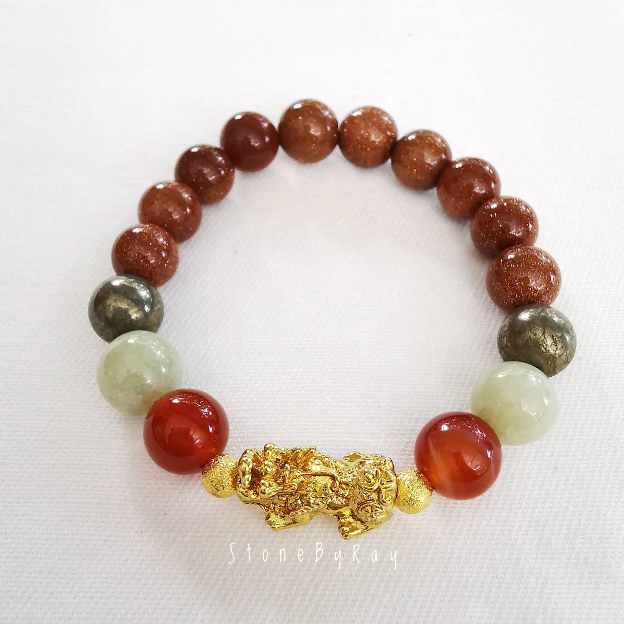 สร้อยข้อมือหินคาเนเลี่ยน,หินทรายทอง,หยก,ไพไรต์ร้อยกับปี่เซี่ยะสีทอง